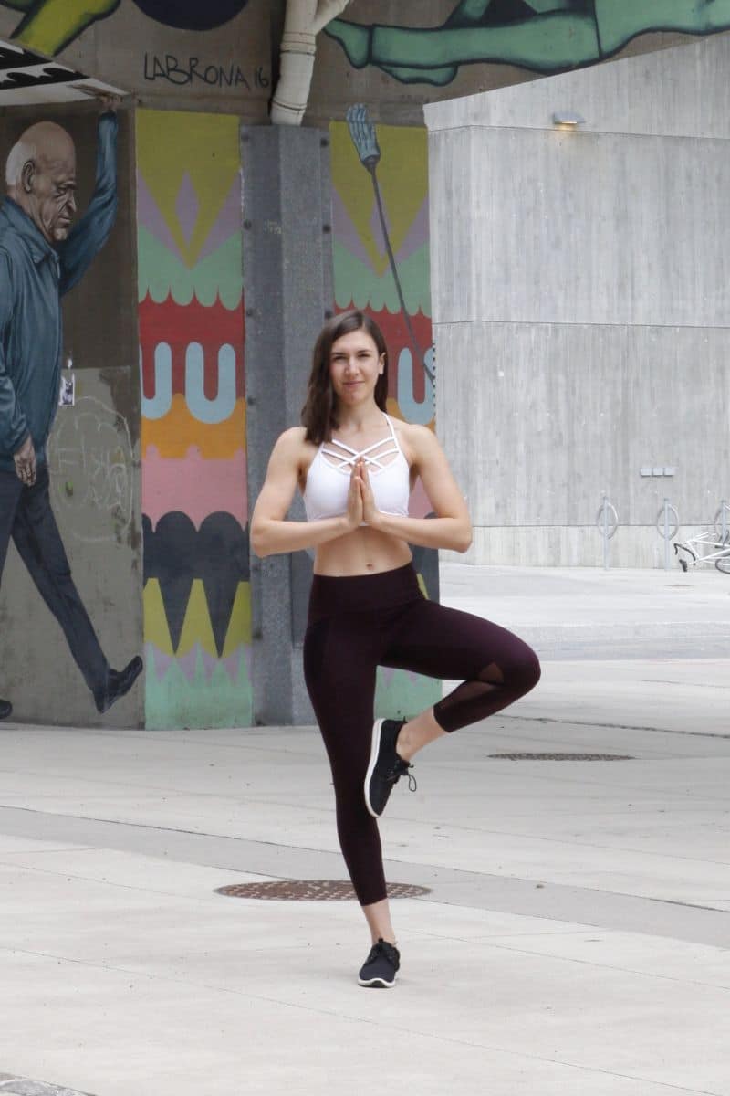 A woman in tree pose