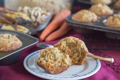 Low FODMAP Banana Carrot Chia Corn Muffins, on plate, split in half