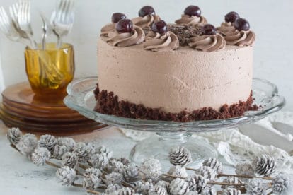 low FODMAP black forest cake on clear glass pedestal