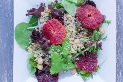 Grains & Greens: Baby Lettuces, Blood Oranges, Quinoa & Chickpeas on a white plate