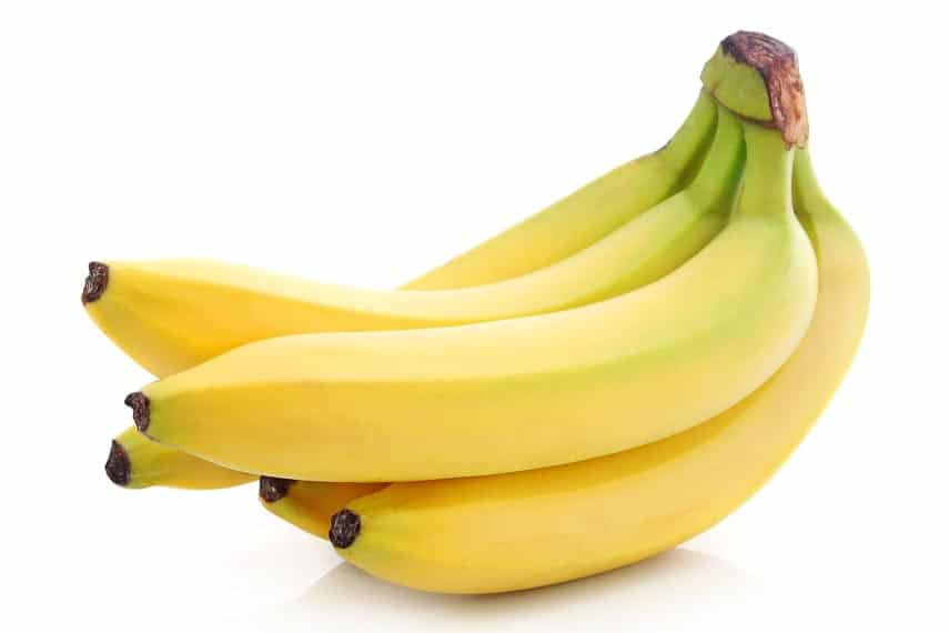 Bunch of unripe bananas showing green on the skin