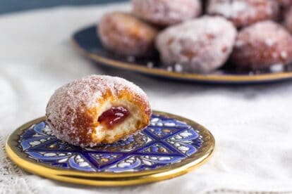 Closeup horizontal image Low FODMAP jelly Donut on blue plate