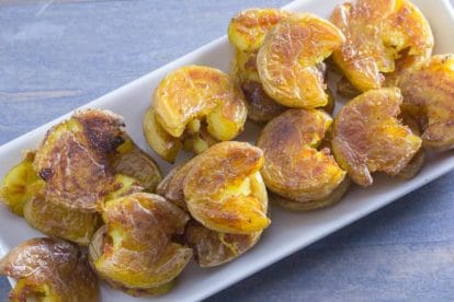 crispy low FODMAP Smashed potatoes on a white platter