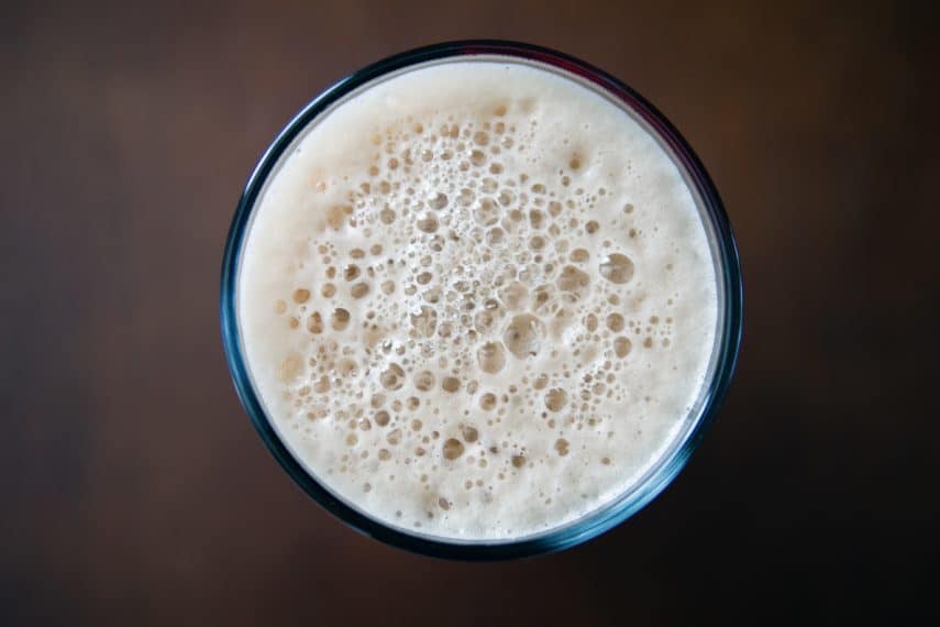 Lactose, Dairy and the Low FODMAP Diet-a birds eye view of a frothy glass of milk