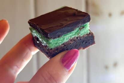 hand holding mint brownie close up.