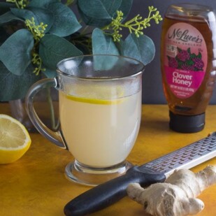 low FODMAP honey lemon ginger tea in a glass mug