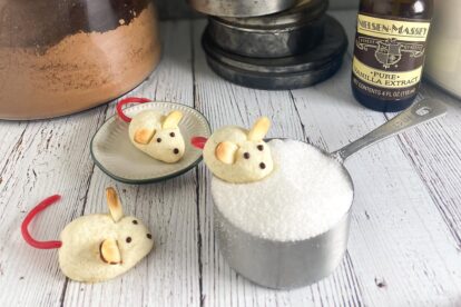 Horizontal image of Low FODMAP Night Before Christmas Mice Cookies on white wood surface