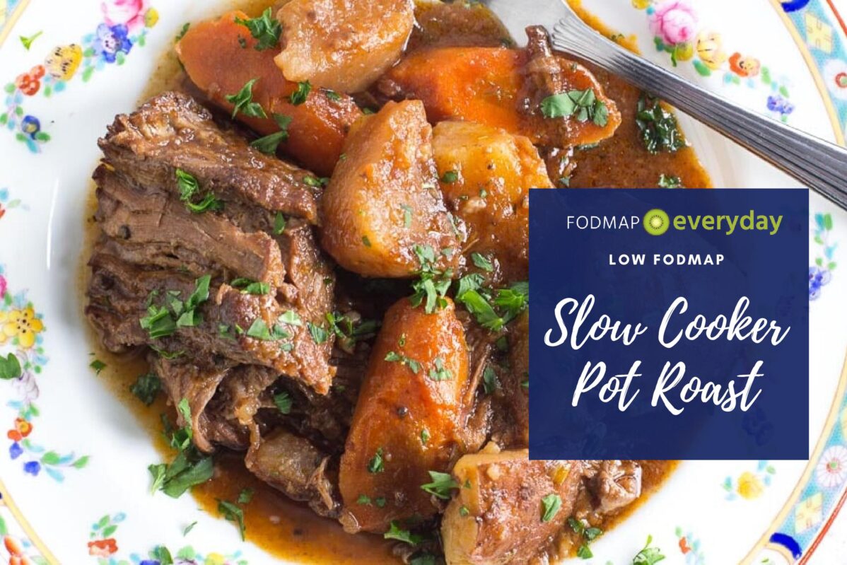 slow cooker pot roast, plated on a decorative floral plate
