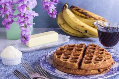 low FODMAP banana oat waffles against blue backdrop