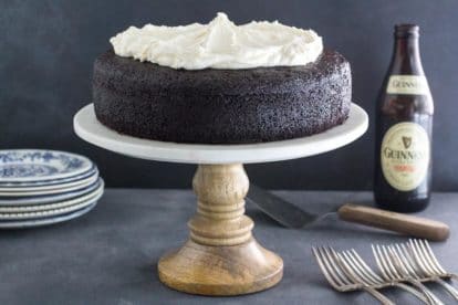 low FODMAP Black Velvet Chocolate Guinness cake with Whiskey Frosting on rustic pedestal
