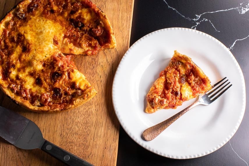 low FODMAP DEEP DISH PIZZA on board and on white plate