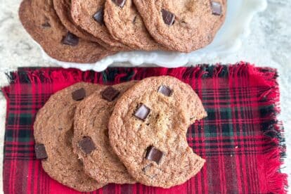 Low FODMAP Gingerbread Chocolate Chunk Cookies on tartan napkin.