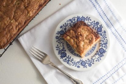 low FODMAP Hummingbird cake; square piece on a blue and white plate