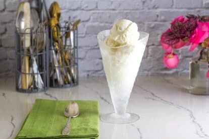 Low FODMAP No-Churn Vanilla Ice Cream in glass dish that looks like an ice cream cone