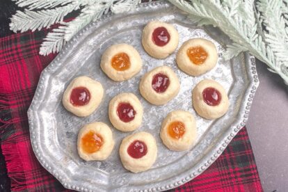 Low FODMAP Thumbprint Cookies on silver platter and red plaid napkin. Gluten-Free Christmas Cookies everyone will love