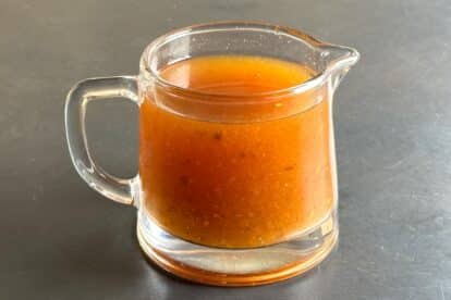 Low FODMAP Vinegar BBQ Sauce in glass pitcher.