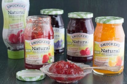 Main image of Smucker's Natural Fruit Spreads in squeeze bottle, jars and in a glass dish