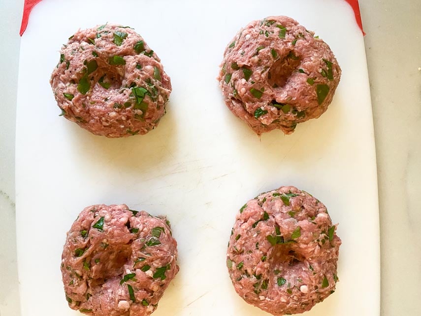 making a dimple in lamb burgers for even cooking