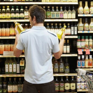 man-reading-food-label