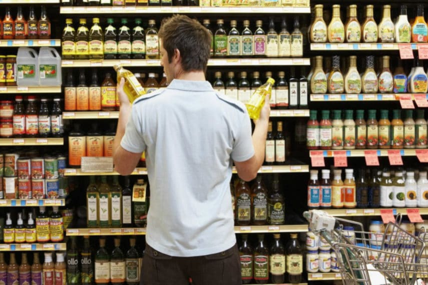 man-reading-food-label