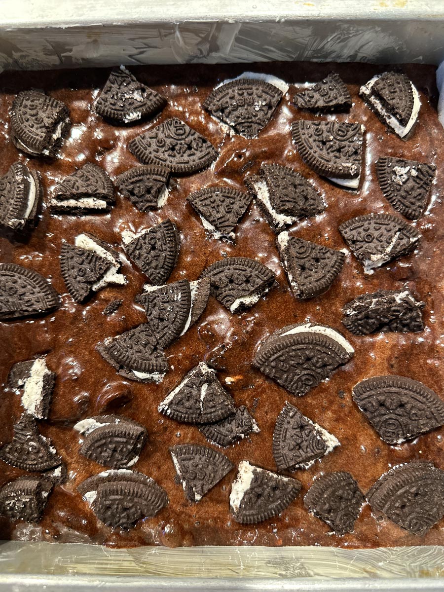 Oreo brownie batter in pan.