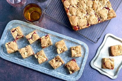 overhead horizontal image of peanut butter and jelly bars on rack and silver trays
