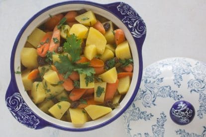 Overhead image of carrot % potato tsimmes in blue and white bowl-2