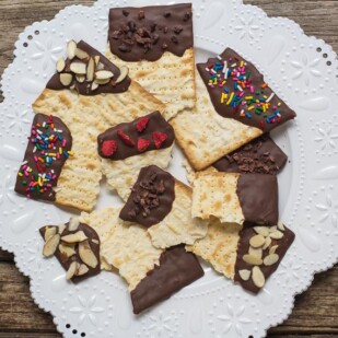 overhead low FODMAP Chocolate covered matzo on a white plate