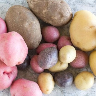 overhead view of an array of potatoes on gray quartz surface