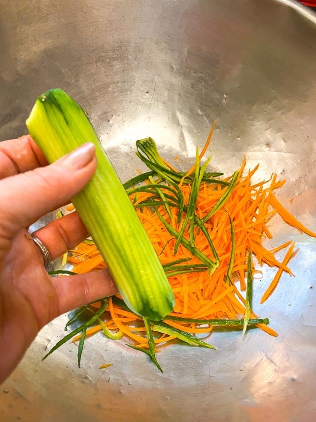 prepping carrot and cucumber for Thai basil Salad prepping carrot and cucumber for Thai basil Salad