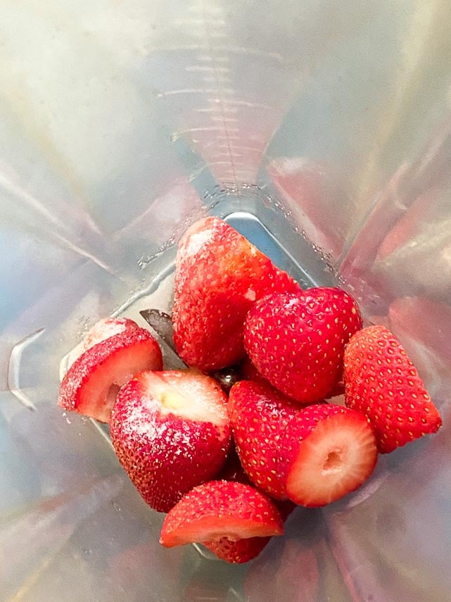 stawberries, sugar and lemon juice in blender carafe