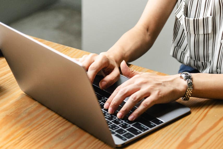 How Are Low FODMAP Recipes Created? typing on laptop