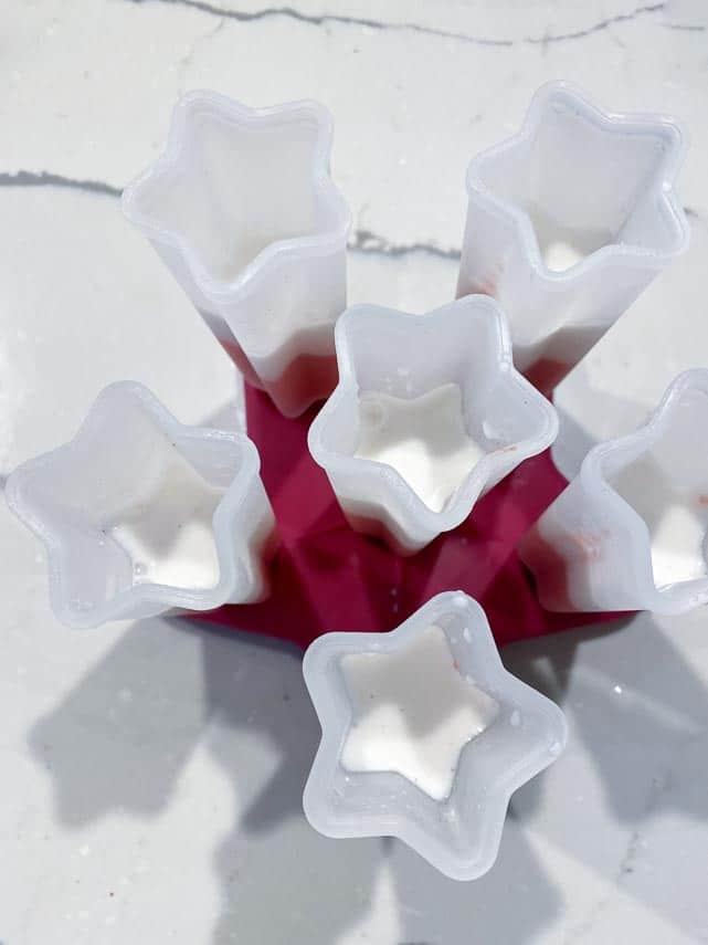 vegan red, white and blue low FODMAP pops being made, showing coconut milk layer