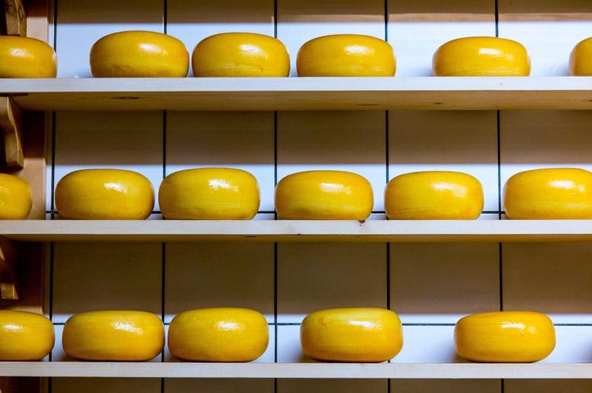 wheels of cheese, aging