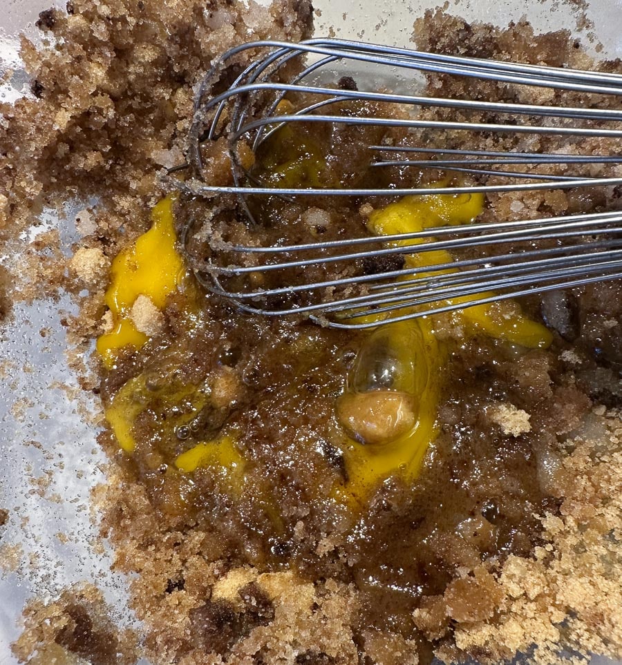 whisking together cookie mixture.