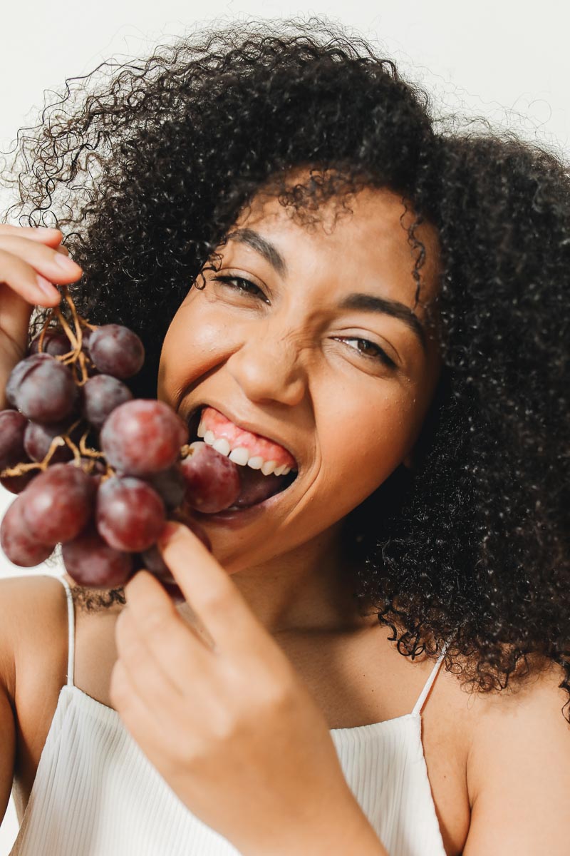 woman eating grapes