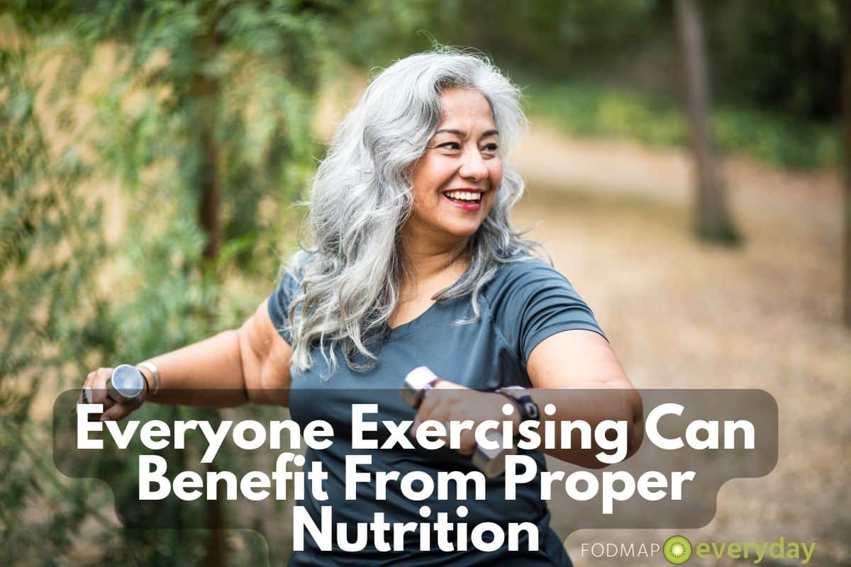 a beautiful middle aged woman with long grey hair weight lifting