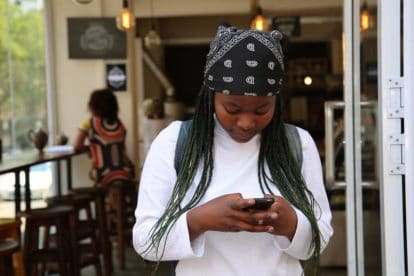 Navigating the low FODMAP diet using social media. young woman looking at phone